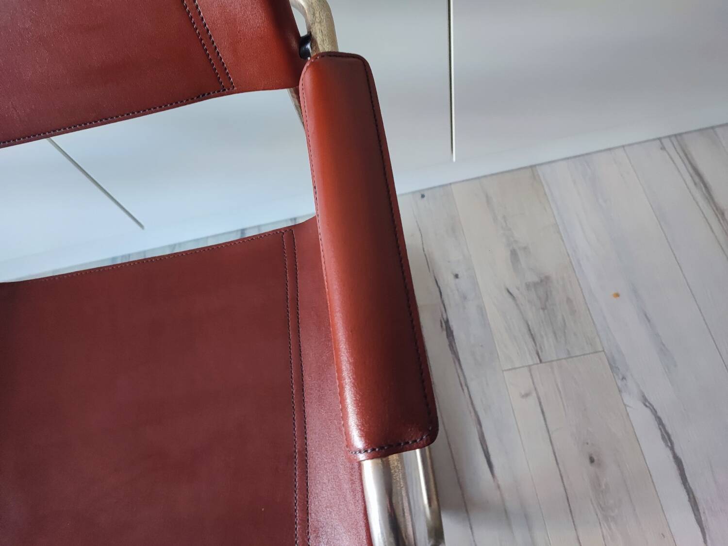B34 armchairs, cognac leather and gilding