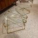 Coffee table and its 4 associated nesting tables in plexiglass and gold metal