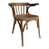 Curved wooden armchair