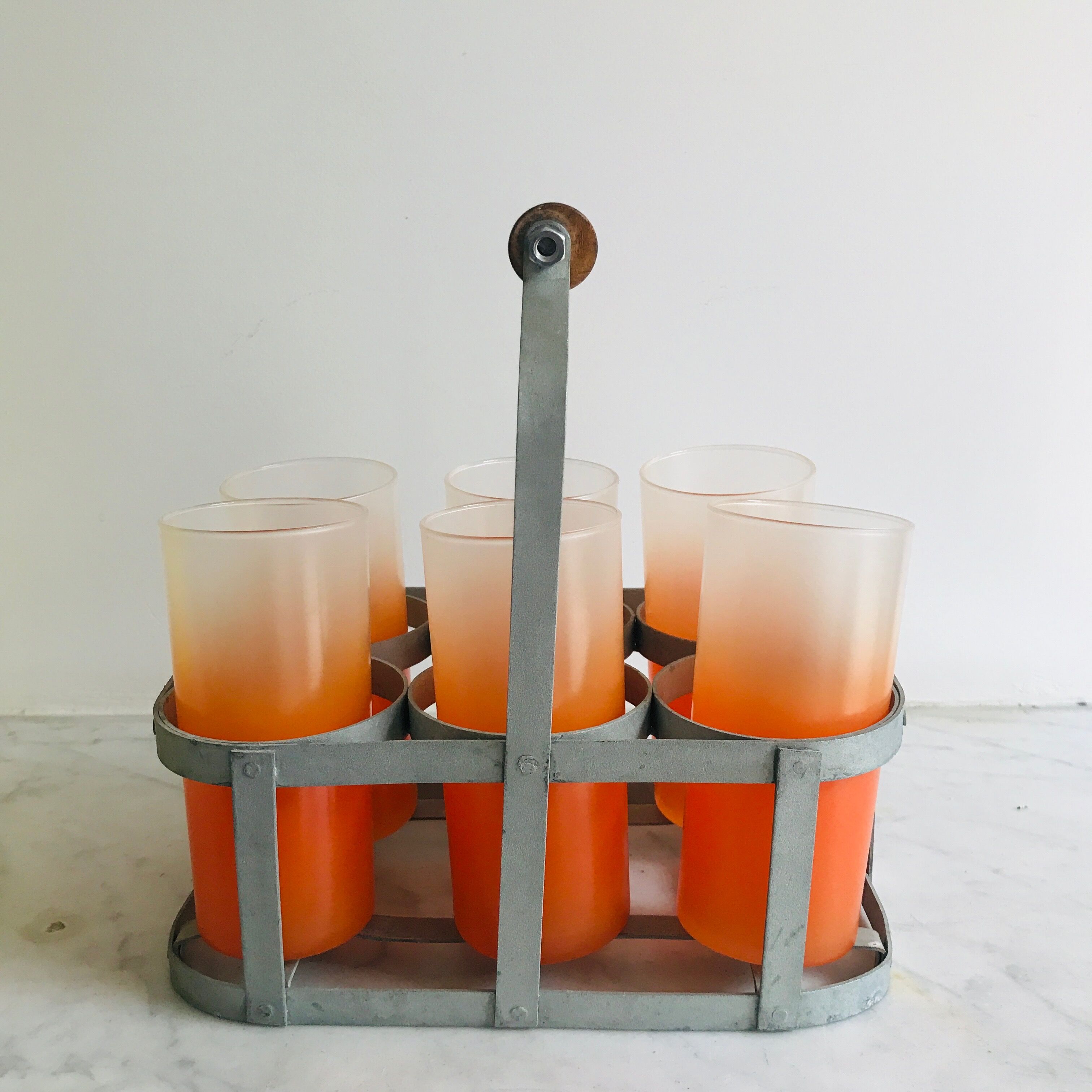 6 orangeades glasses in their basket