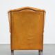 Cow leather wingback chair finished with decorative nails