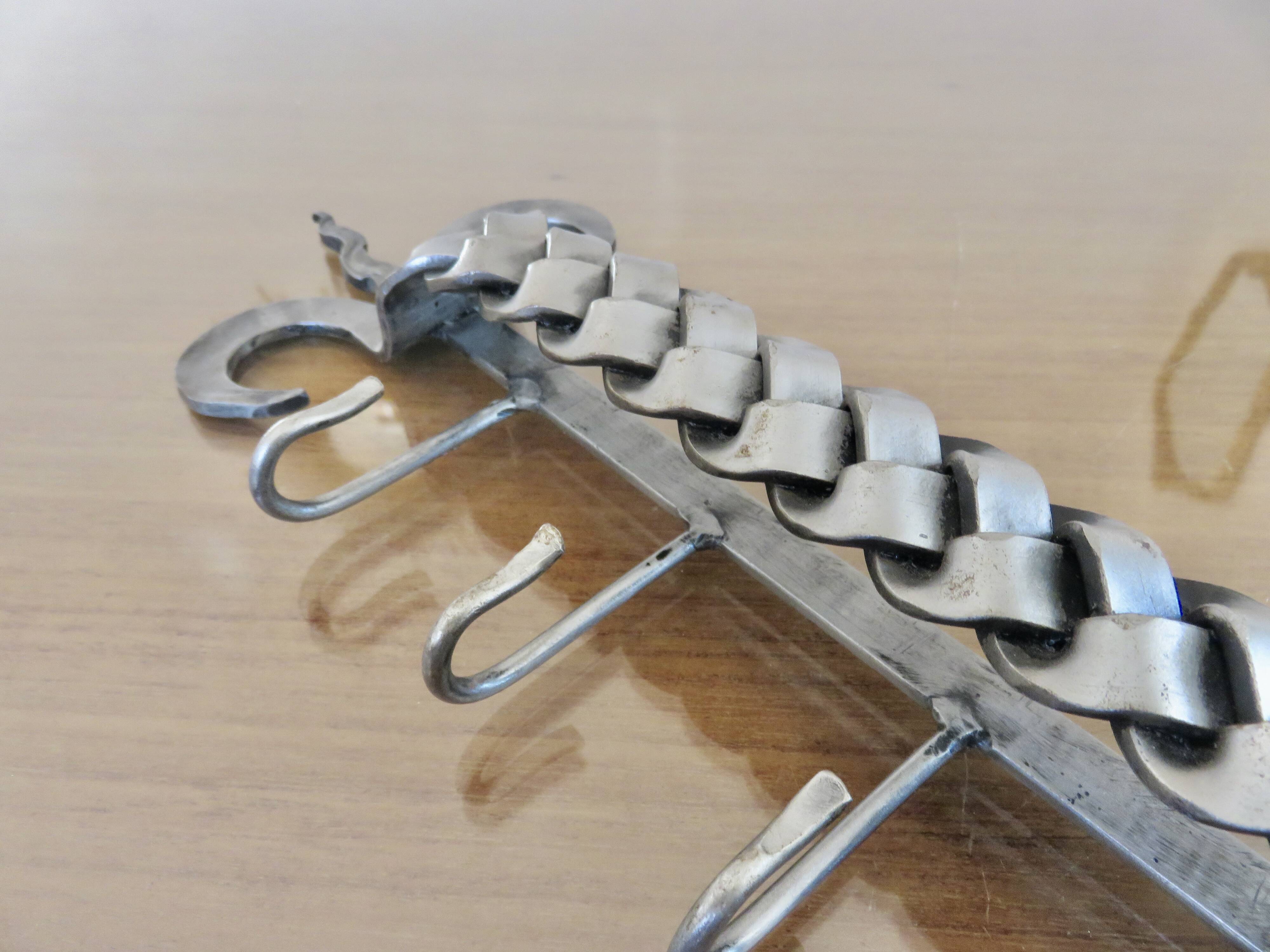 2 Tea towel holders, ironwork in braided raw steel, 1970