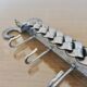 2 Tea towel holders, ironwork in braided raw steel, 1970