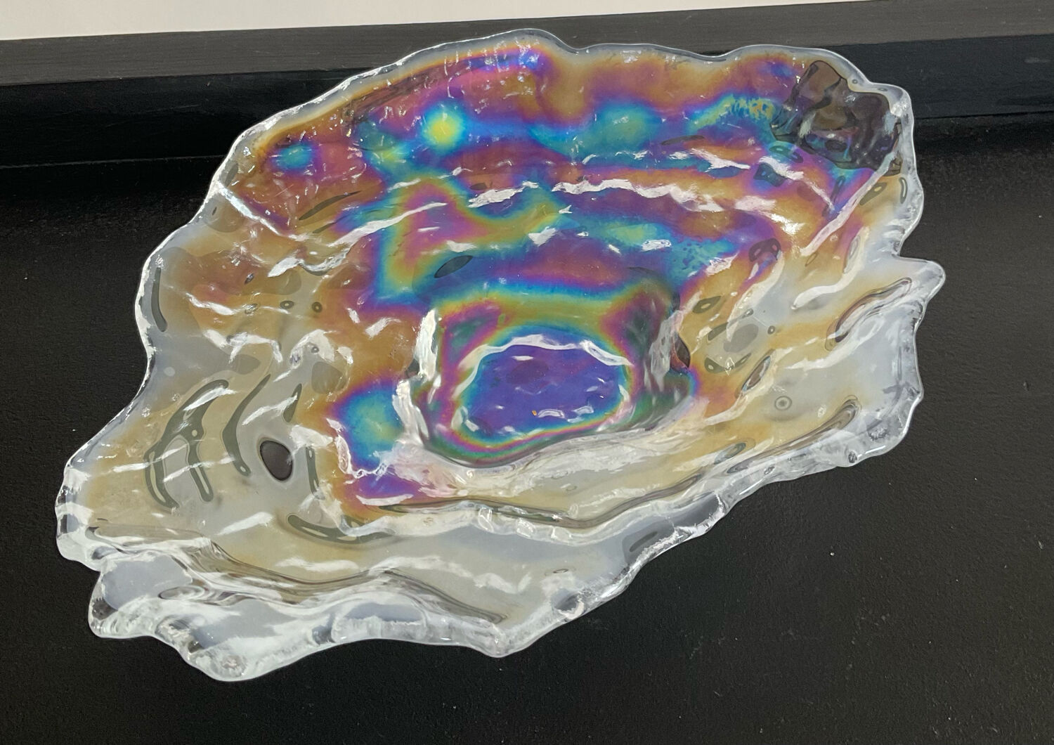 Empty vintage pocket in iridescent glass