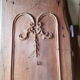 Wearing old 18th century decoration carved with flowers and foliage