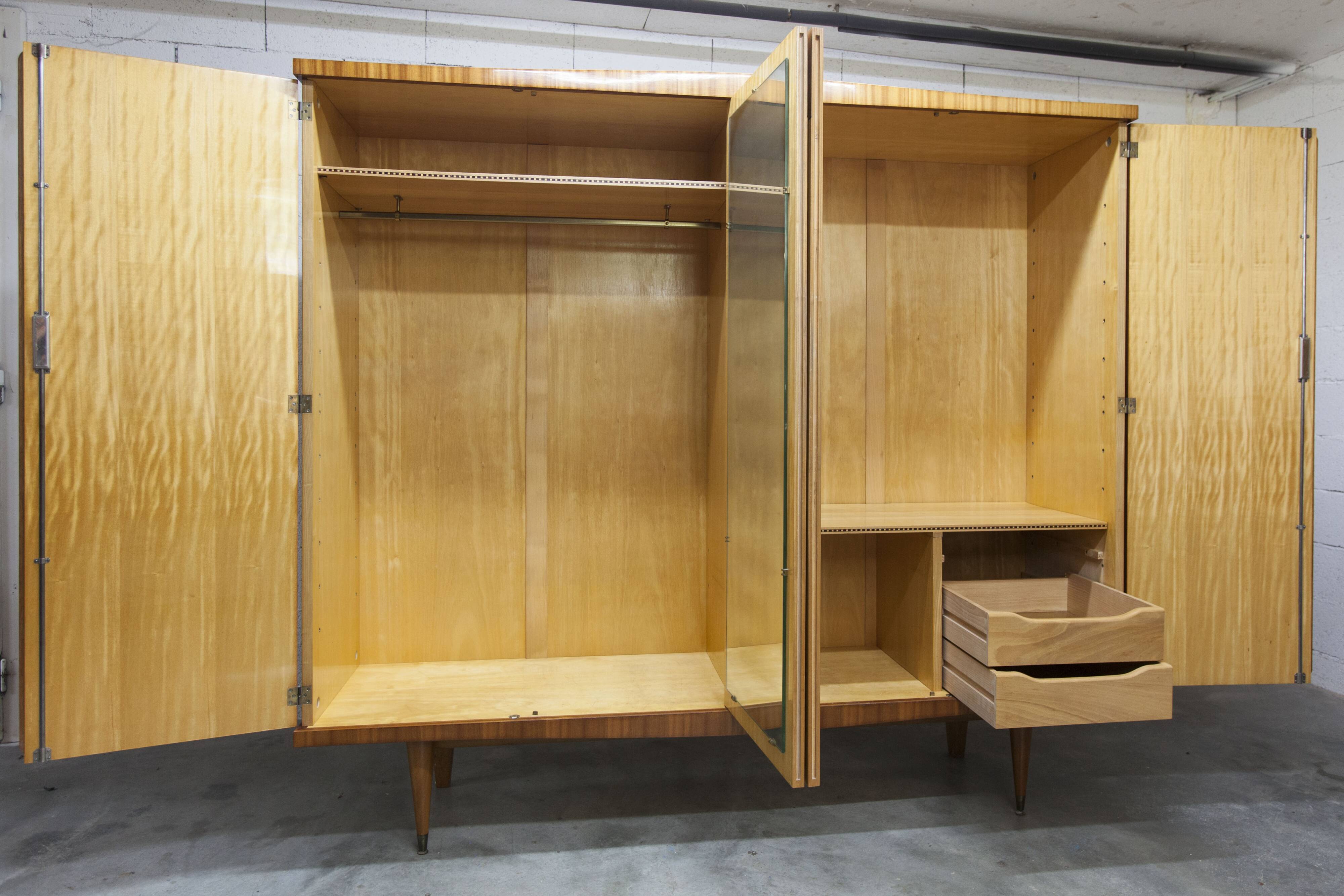 1960s Scandinavian wardrobe, blonde varnished wood, unusual, 4 doors, 3 drawers, 7 shelves.