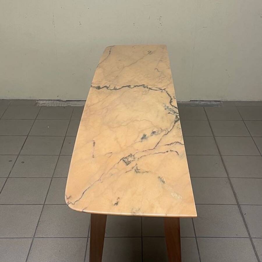 Console from the 1950s with a pink marble top and a cherry wood frame.