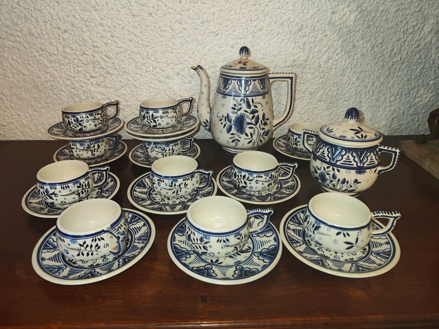 Henriot Quimper earthenware coffee set with floral decoration and elegant blue