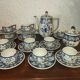 Henriot Quimper earthenware coffee set with floral decoration and elegant blue