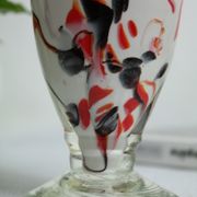 Corolla vase in white opaline with orange-brown patterns.