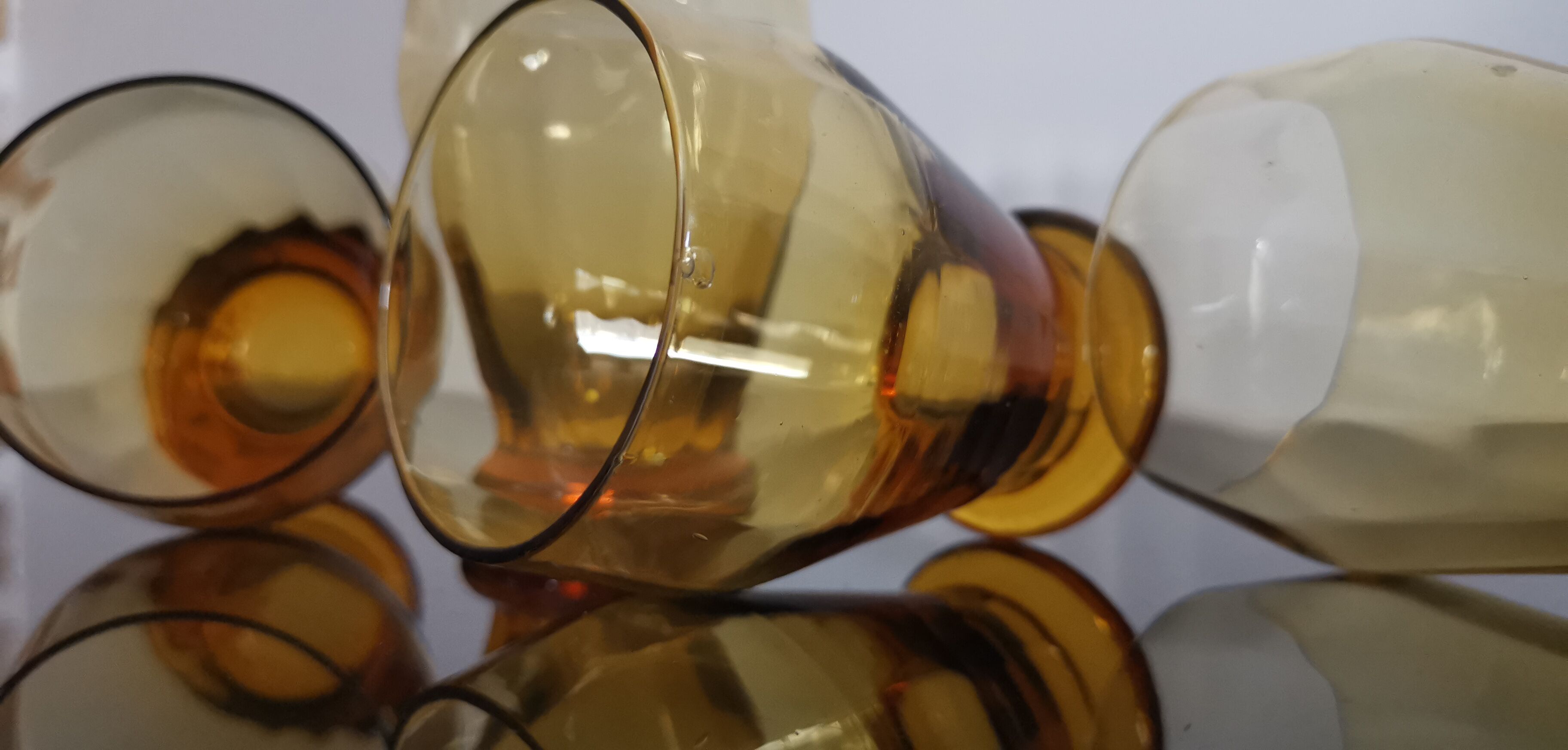 4 old amber colored glasses