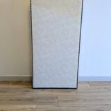 Vintage white faux leather screen with four studded panels, elegant decor.