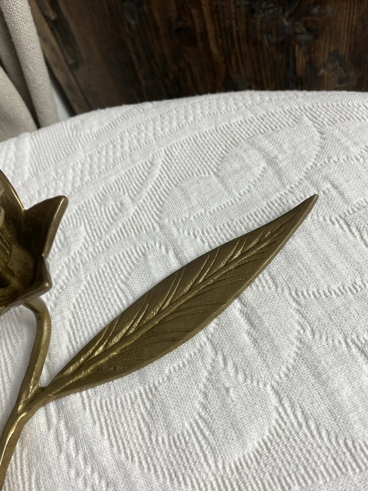 Flower candlestick and removable ashtrays in solid brass.