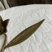 Flower candlestick and removable ashtrays in solid brass.