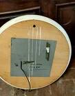 1970s mirror with integrated lighting, futuristic design, vintage wood.