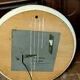 1970s mirror with integrated lighting, futuristic design, vintage wood.