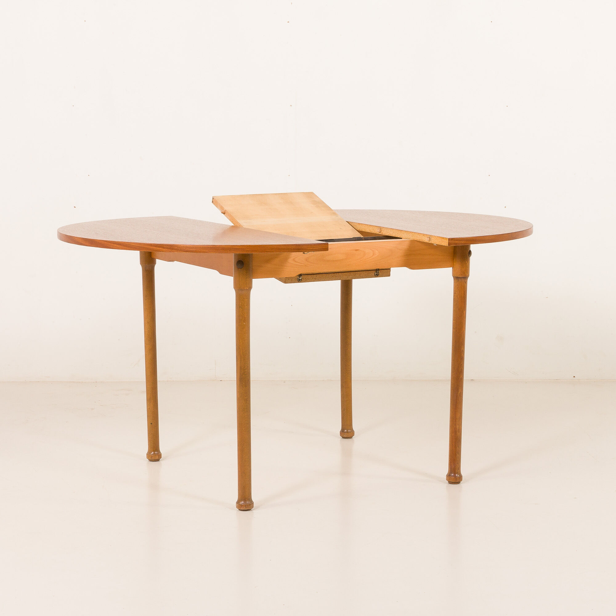 Teak round table with hidden extension, 1970s
