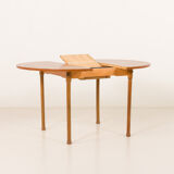 Teak round table with hidden extension, 1970s