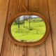 Vintage rattan apple mirror