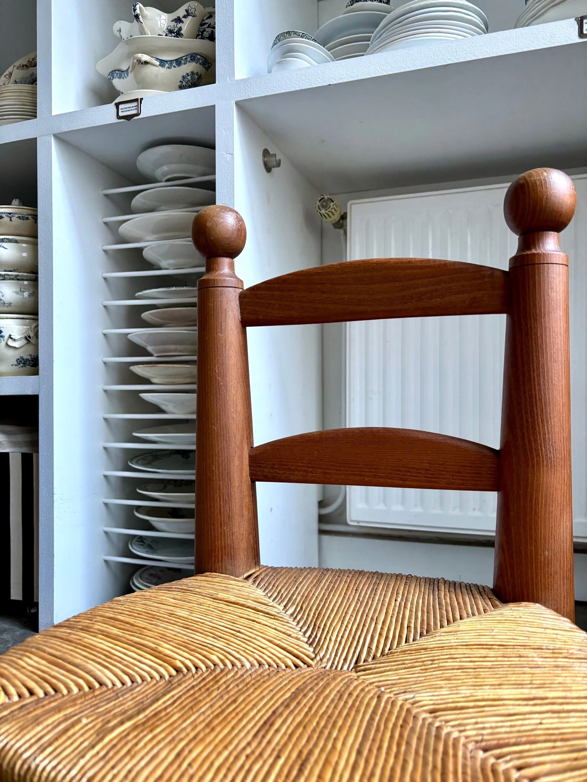 Brutalist low chair in dark wood and straw no. 3