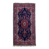 Tapis Kerman antique en laine bleue et rouge