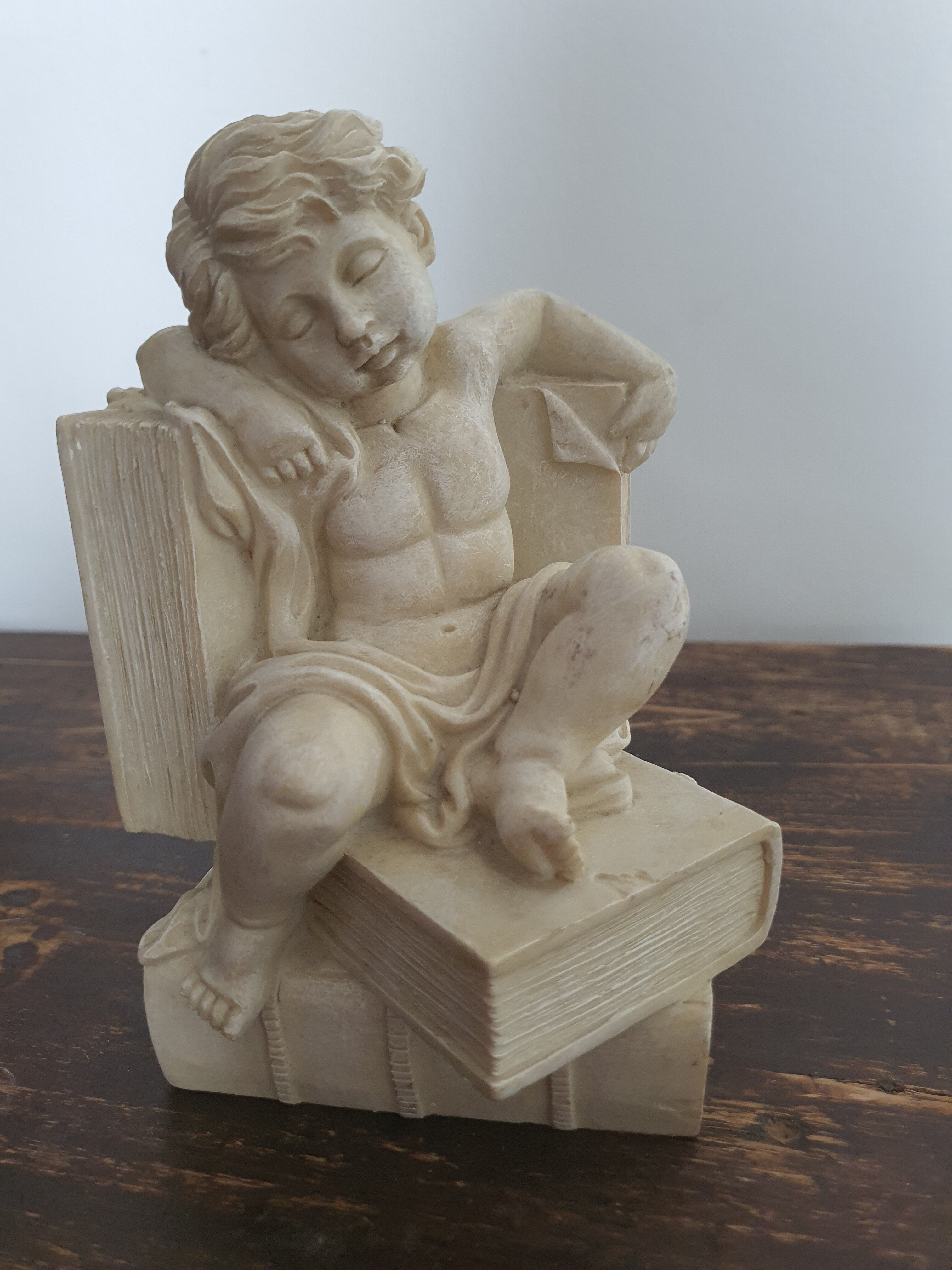 Angel bookends sitting in stone art deco 1950