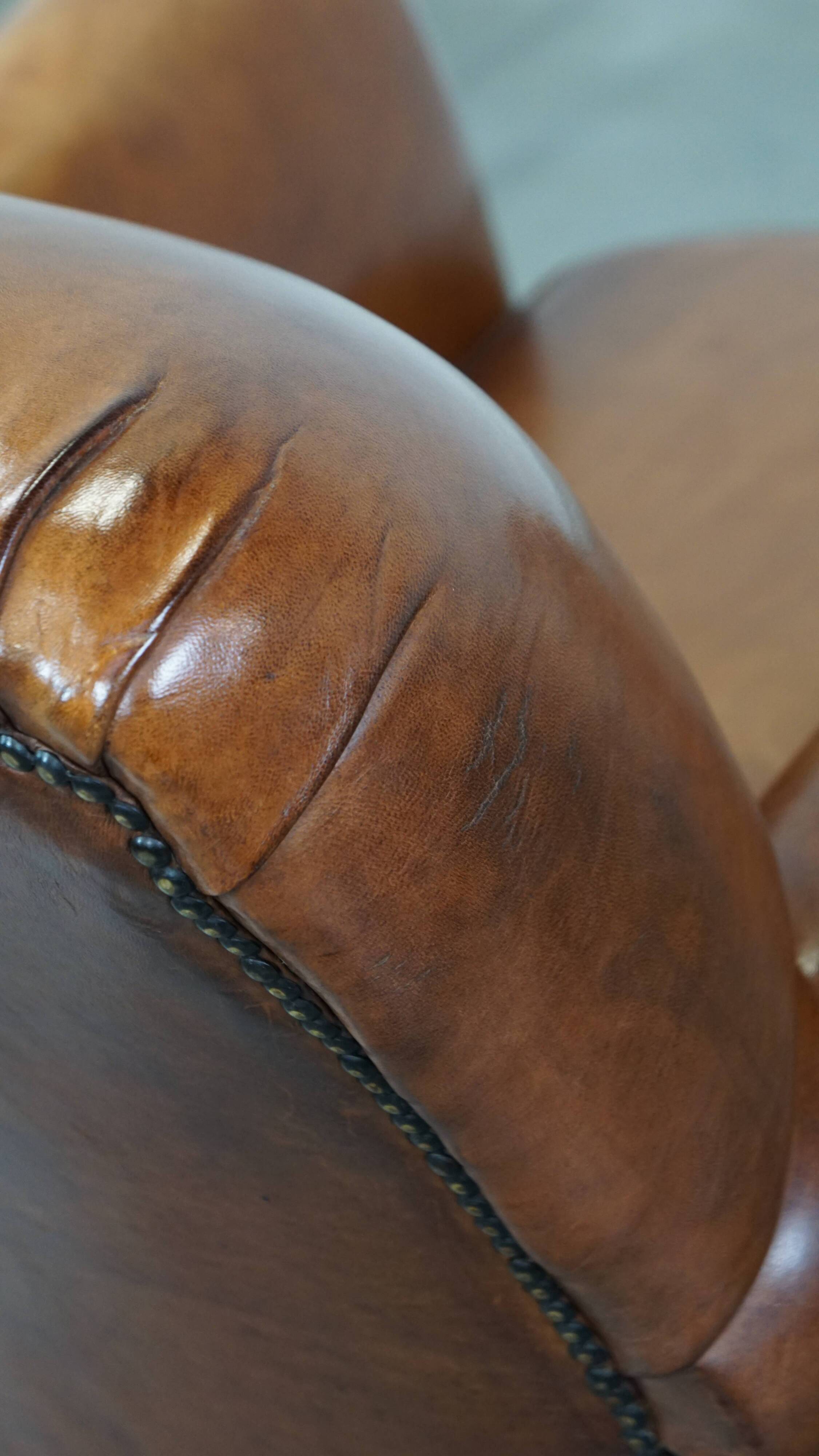 Cognac-colored antique sheep leather armchair