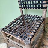 Vintage armchair in woven leather and wood