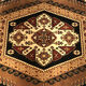 Wool carpet with oriental decoration on a brown background