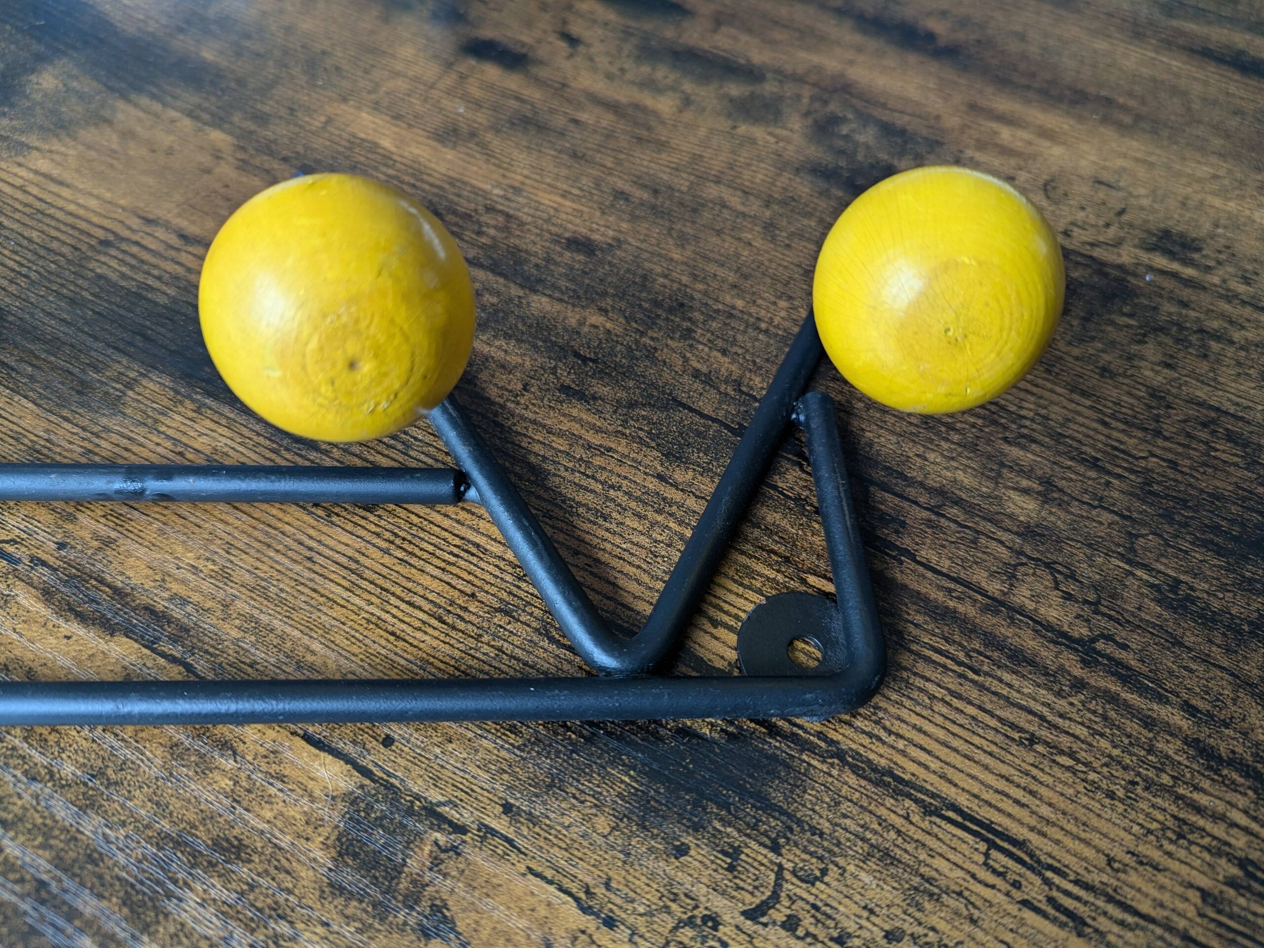 Vintage coat rack Roger Feraud with 4 yellow ball hooks.