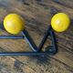 Vintage coat rack Roger Feraud with 4 yellow ball hooks.