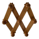 Foldable ball coat rack made of fir wood.