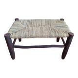 Moroccan bench in dark wood with woven palm leaf seat