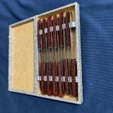 Set of 12 vintage red bakelite knives