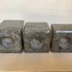 Trio of square candlesticks in veined marble