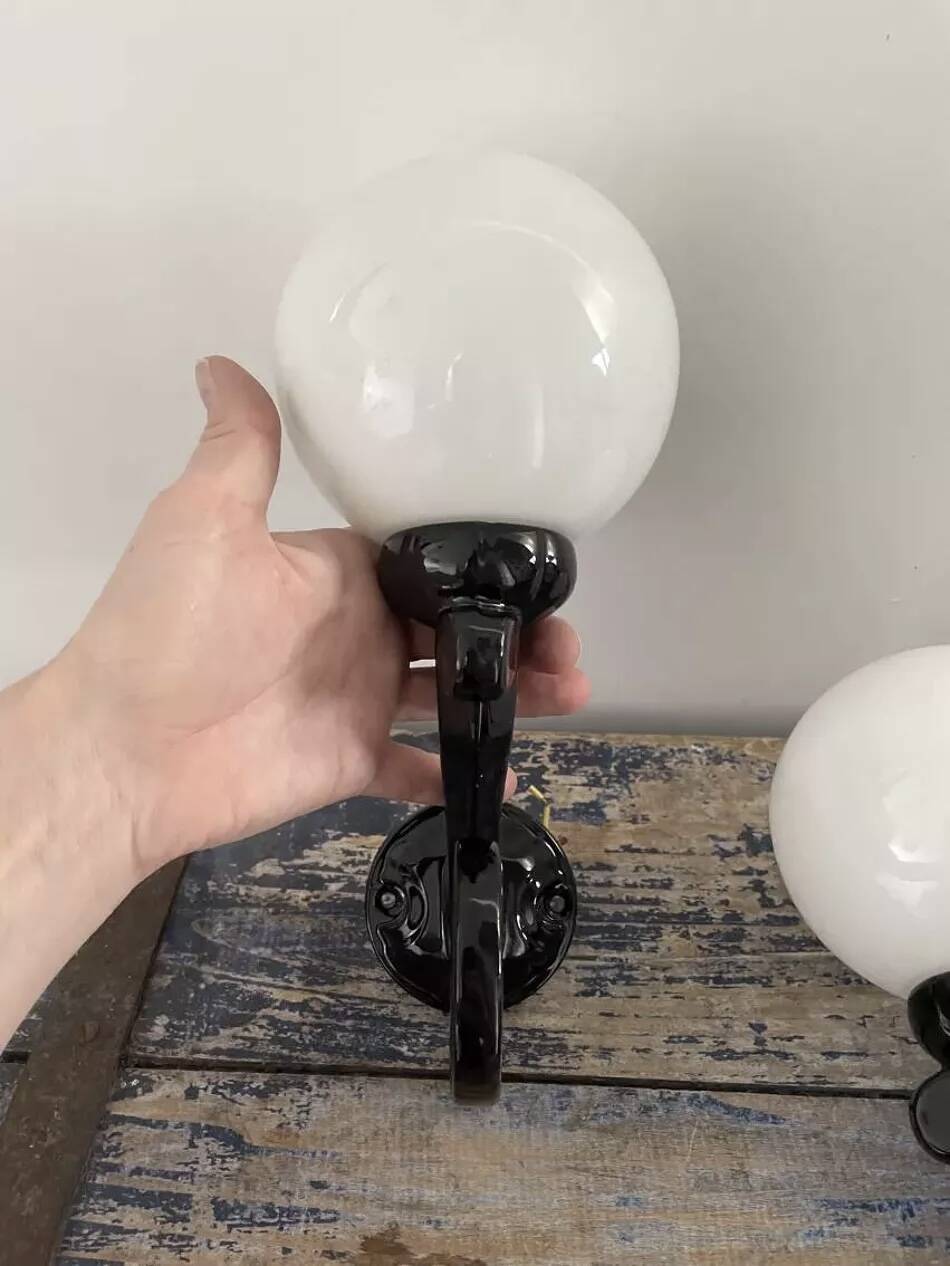 Pair of vintage enameled cast iron wall sconces