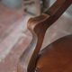 Barber chair in wood and leather with adjustable headrest, office chair.