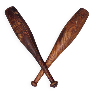 2 old wooden juggling clubs