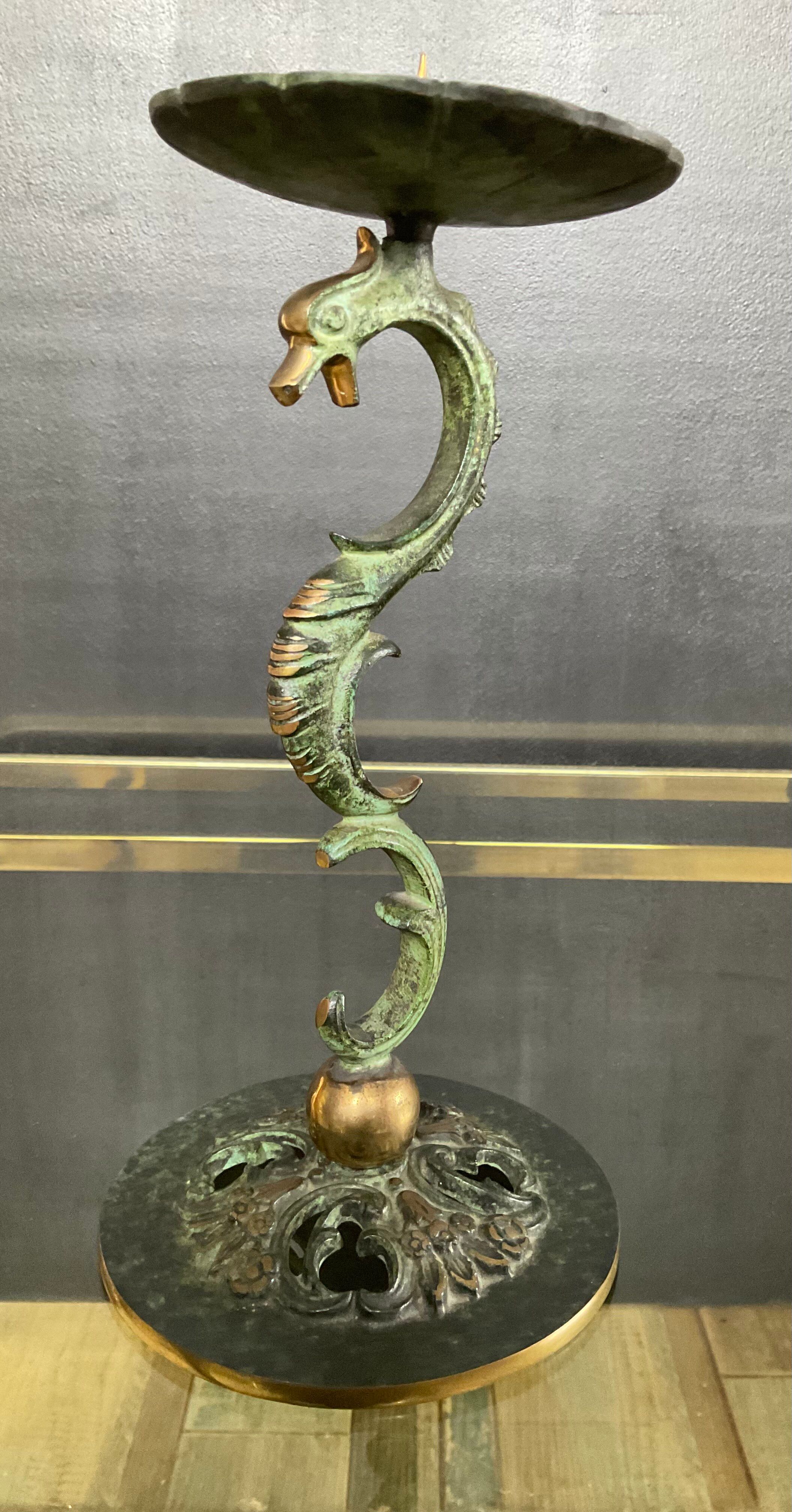 Empire style bronze candlestick with a candle holder