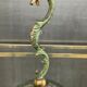 Empire style bronze candlestick with a candle holder
