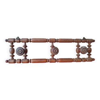 Old wooden wall coat rack