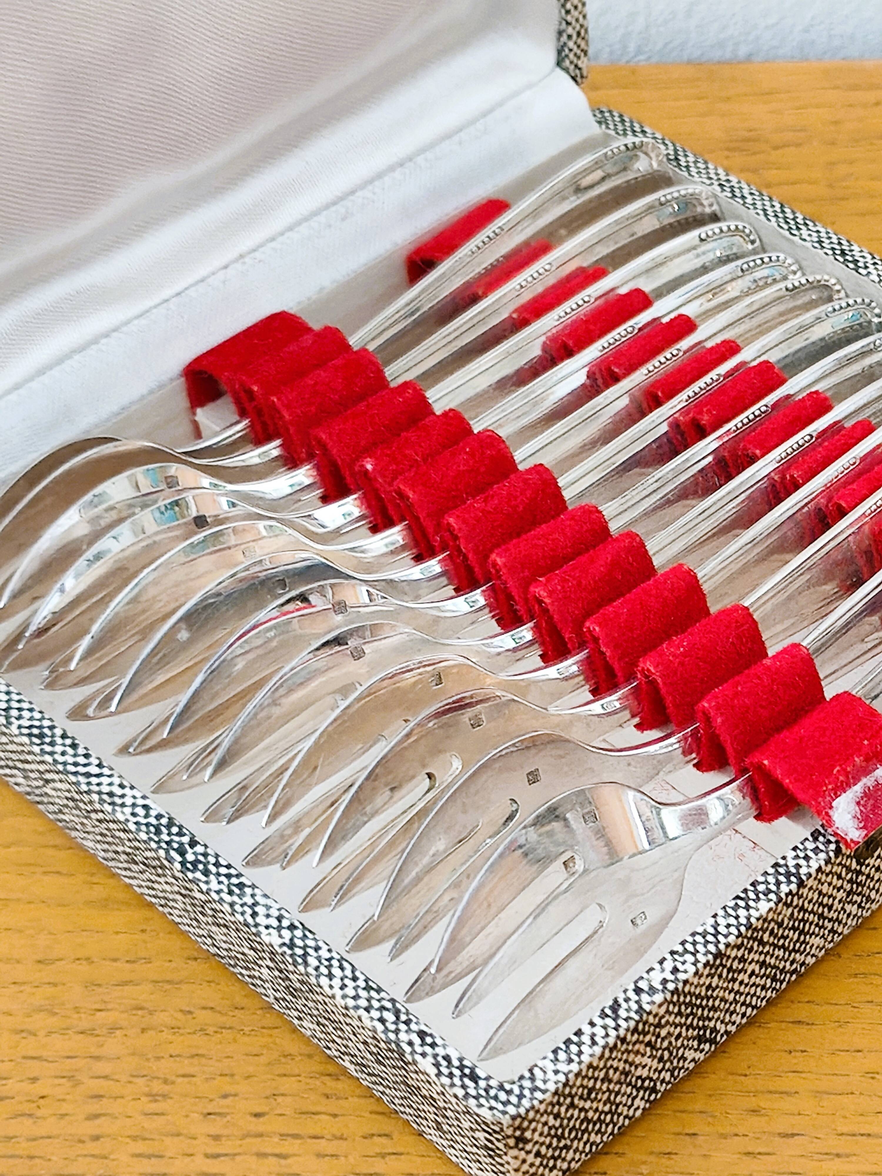 Set of 12 dessert/fish forks in silver-plated metal with hallmark.