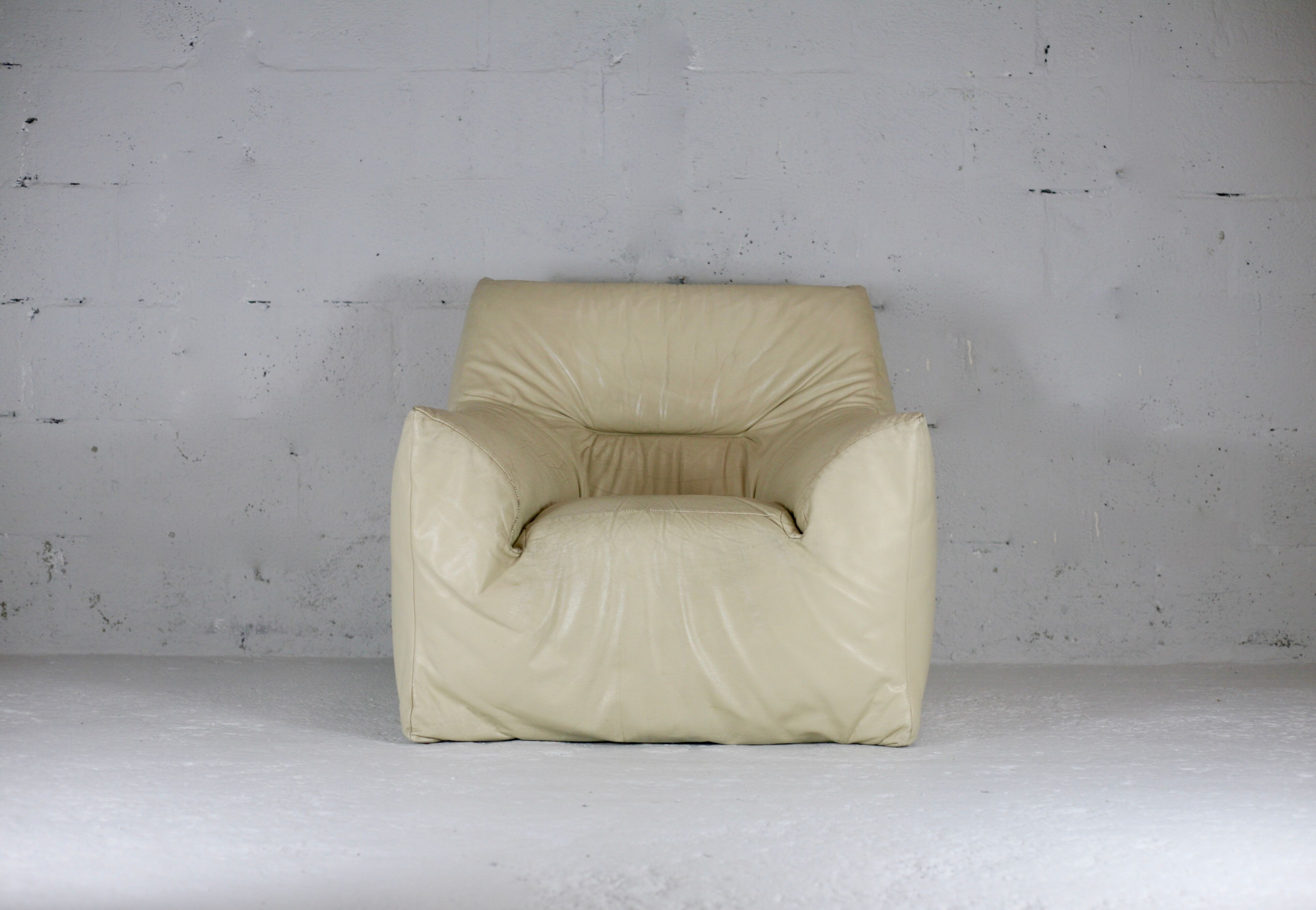 Leather armchair and cream-coloured foam, France , circa 1970