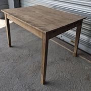 Old farmhouse table with its 2 extensions and raised legs.