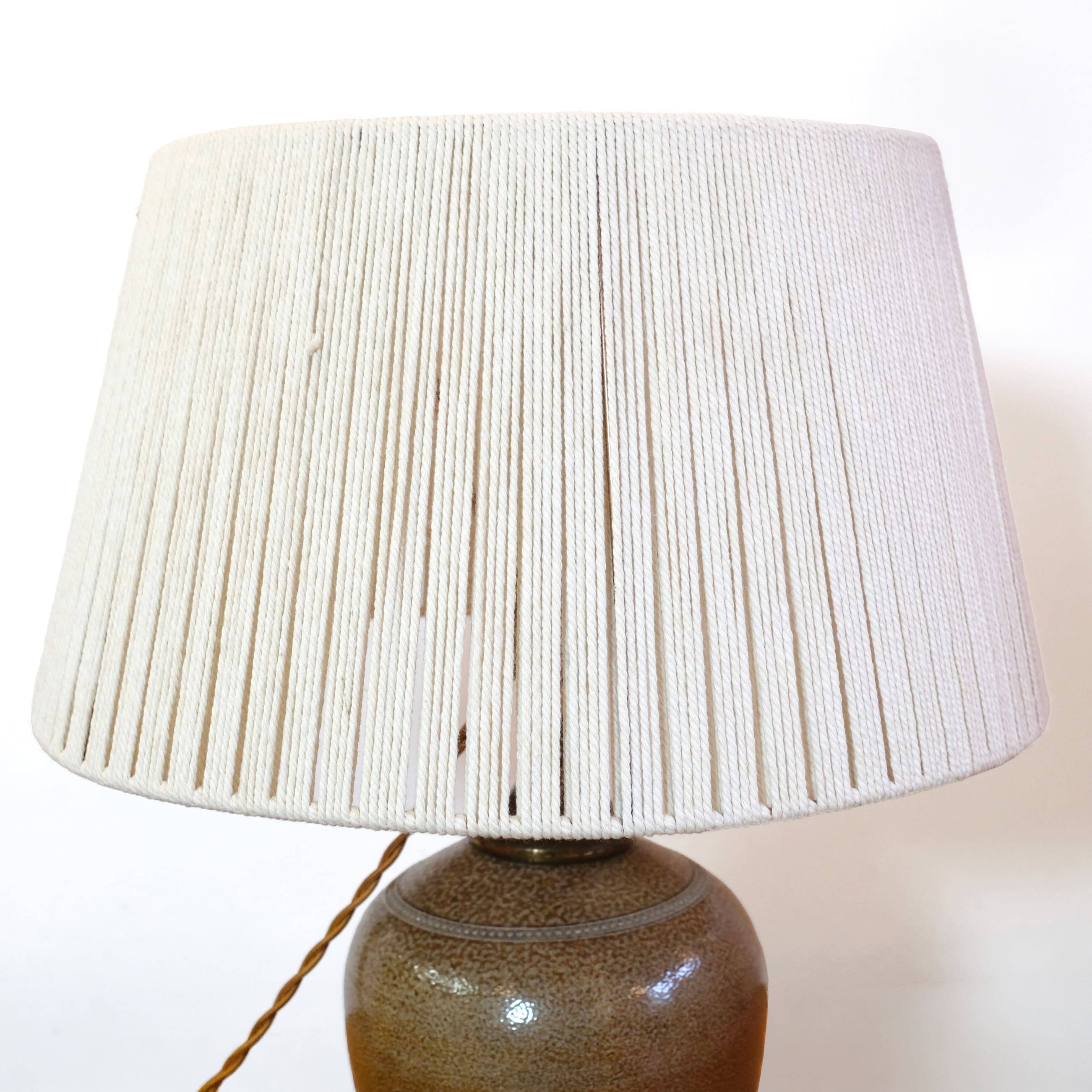 Stoneware lamp with a cotton thread shade, 1970s.