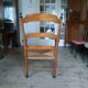 Large fauteuil paillé