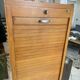 1950s oak office storage cabinet with curtains.