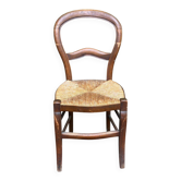 Vintage solid oak chair with rush seat, Louis Philippe style from the 20th century.