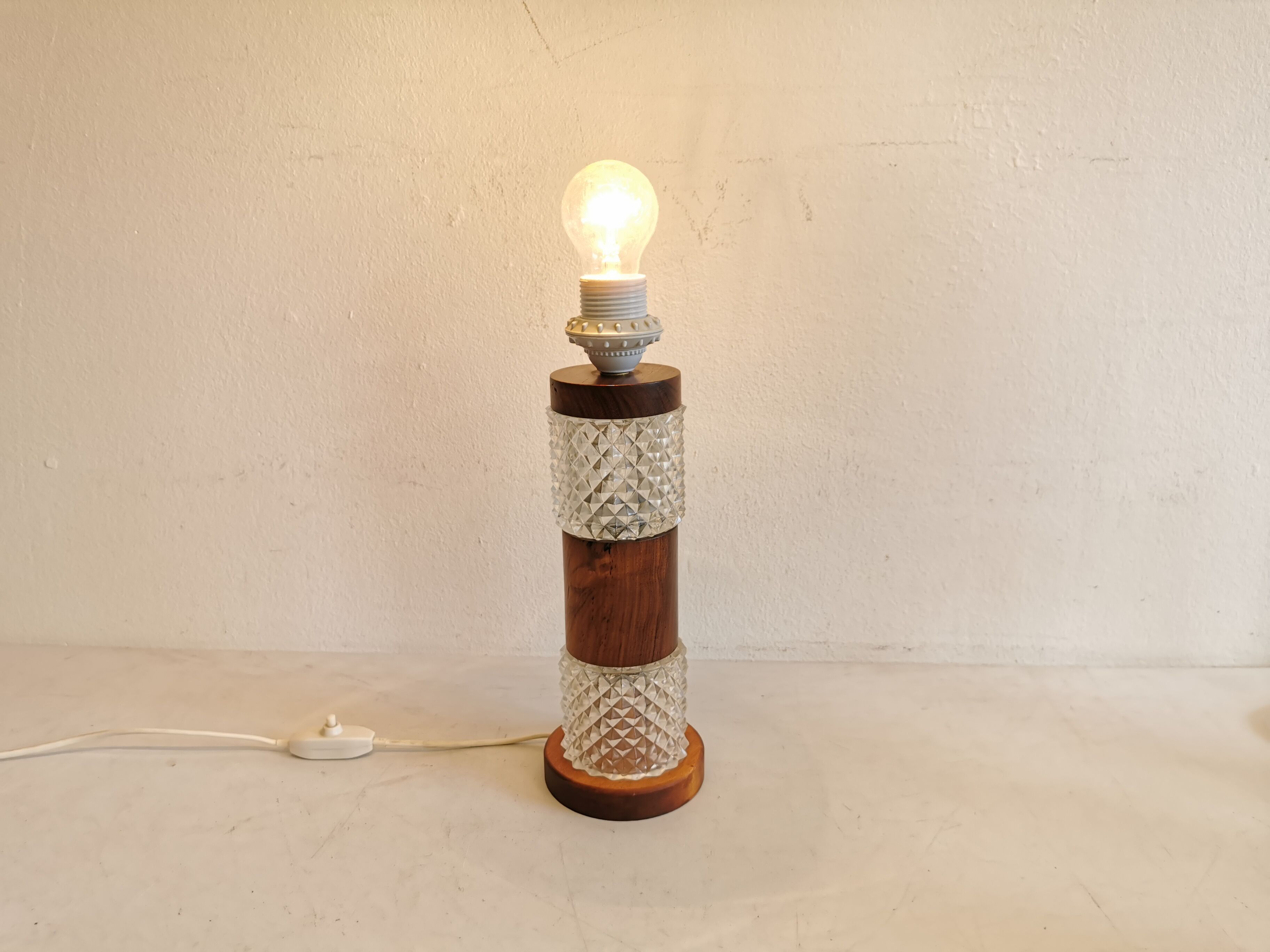 Swedish table lamp, made of what looks like rosewood and crystal glass.