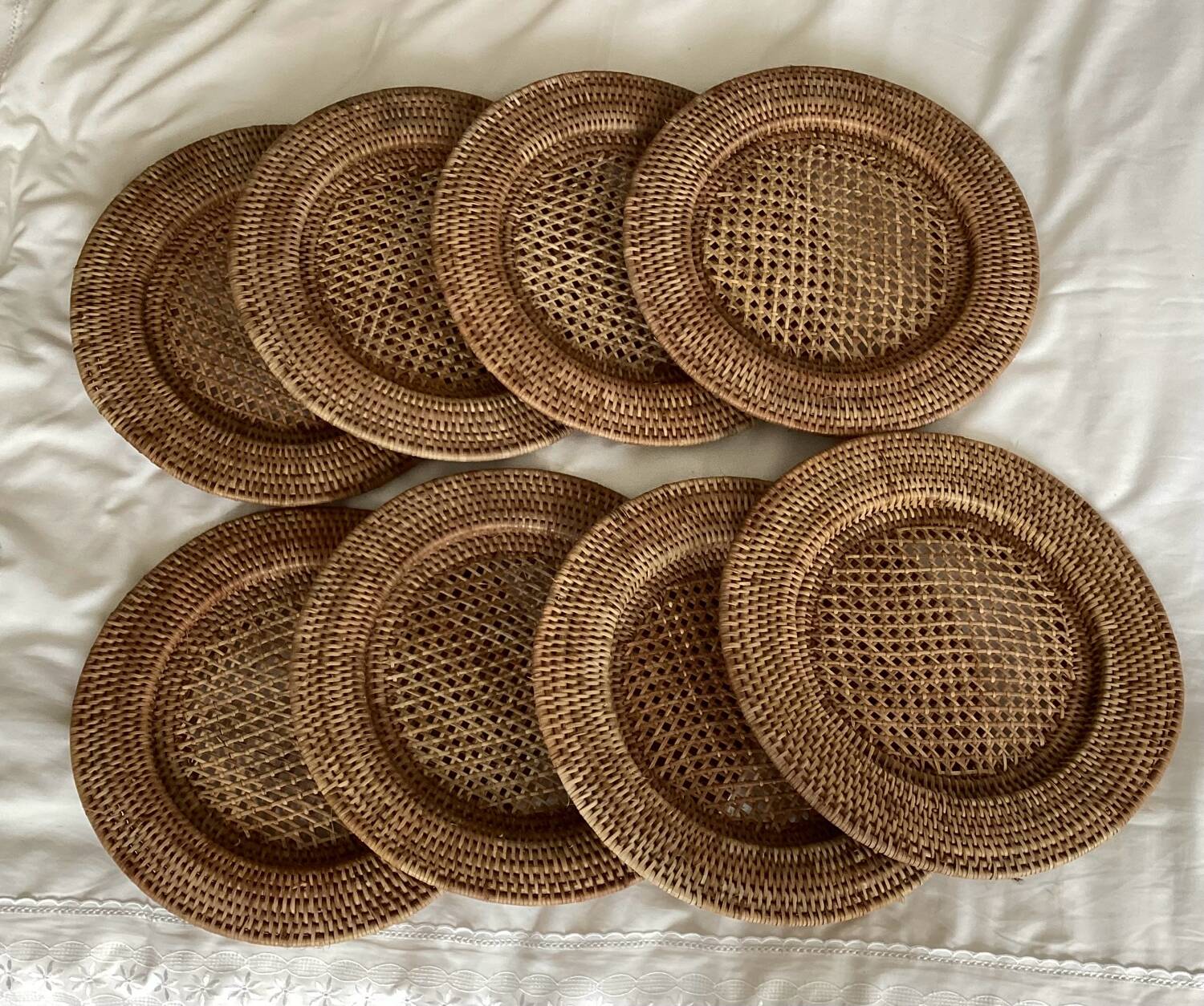 Set of round woven rattan and canework coasters
